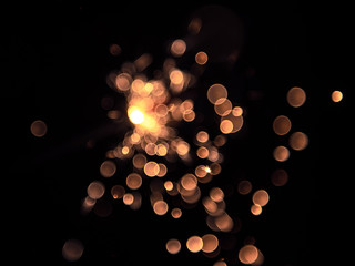 Sparkler on black background. Bokeh blur. Out of focus.