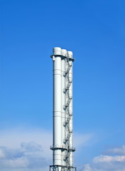 high industrial white pipe pylone on blue sky in sunny day, environment diversity