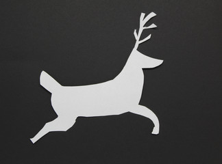 white card christmas reindeer on black background