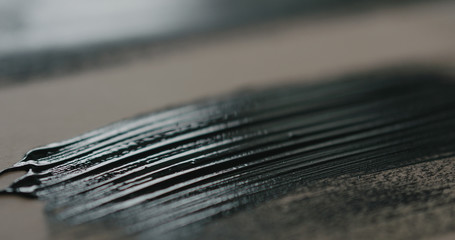 closeup of painted black plywood
