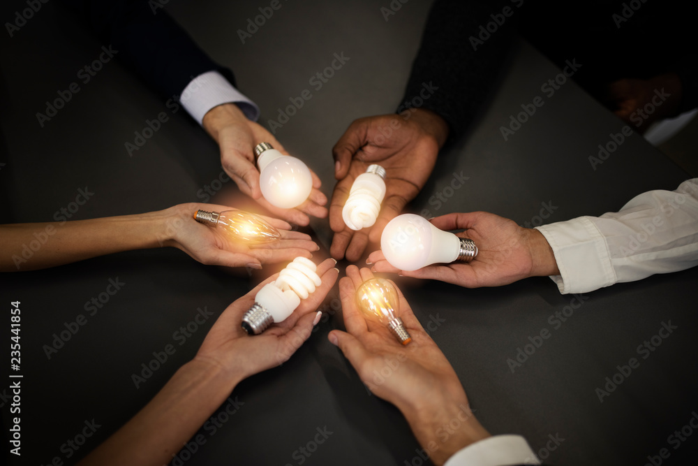 Poster teamwork and brainstorming concept with businessmen that share an idea with a lamp. concept of start
