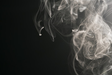 closeup abstract vapor over black background for backdrop or overlay
