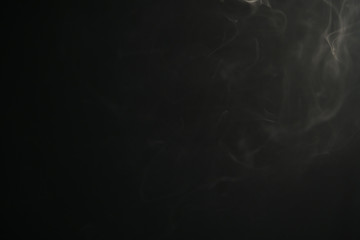 closeup abstract vapor over black background for backdrop or overlay