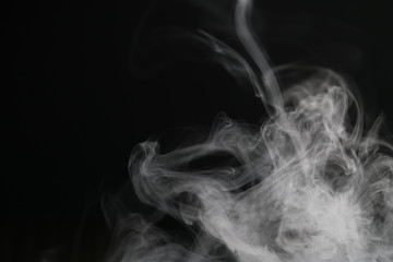 closeup abstract vapor over black background for backdrop or overlay