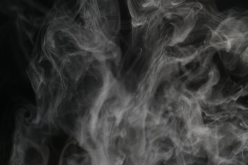 closeup abstract vapor over black background for backdrop or overlay