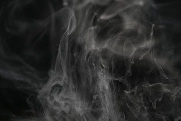 closeup abstract vapor over black background for backdrop or overlay