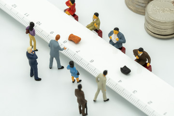 Miniature People use cash deposit. At the bank counter or financial institution. There are many...