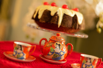 Bundt Cake with white chocolate and candied cherries.