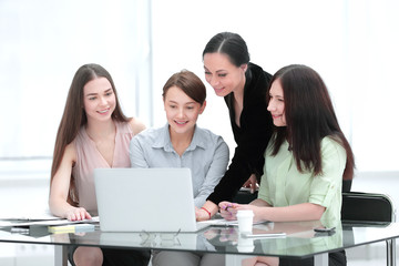 business woman and group of young employees using laptop to work