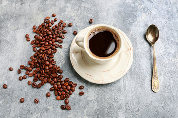 Cup of coffee on grey stone background