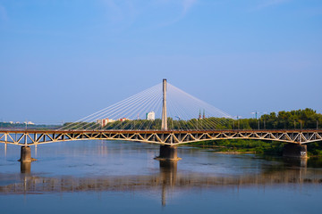 Fototapeta na wymiar Warsaw, Poland - Panoramic view of the Vistula river with Most Srednicowy railway bridge and northern district of Warsaw