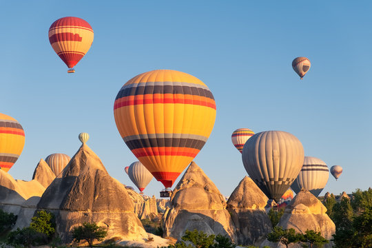 Airballoons in Turkey, Cappadocia. Travel and leisure. Adventure in the air. Concept and idea of adventure. Airballoons on the sky background