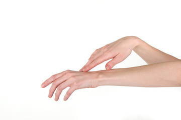 Elegant female hands on a white background. Self care, skin care.
