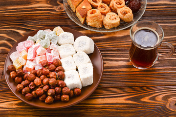Sweet baklava on plate with coffee. 