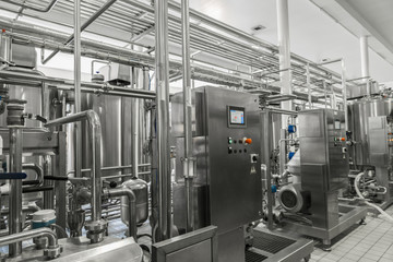 electronic control panel and tank at a milk factory. equipment at the dairy plant