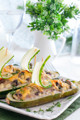 Stuffed with minced meat and zucchini mushrooms in the shape of boats with a fresh cucumber sail, selective focus