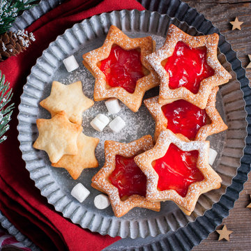 Christmas cookies. Linzer cookies with raspberry jam, sguare