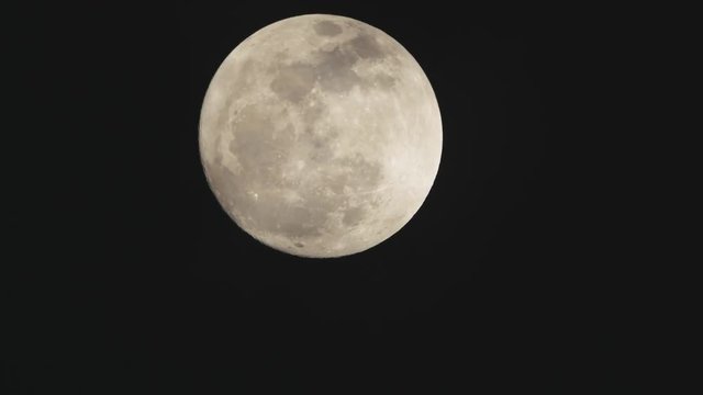 Full Moon in dark sky.