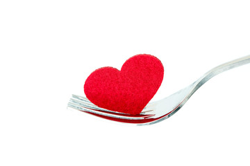 the red heart shape in silver fork , romance love dinning or health heart care concept
