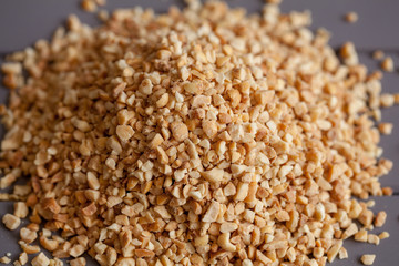 Nuts meal. Crushed nuts. Peanut meal. Grounded nuts