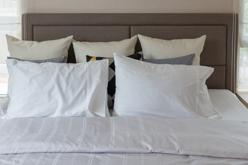 Fototapeta na wymiar white pillows on bed in modern bedroom