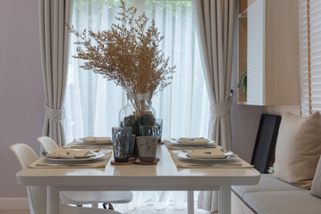 modern table set on wooden dining table