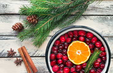 Christmas potpourri. Top view. Hot scented beverage made from cranberry, cinnamon, clementines and...