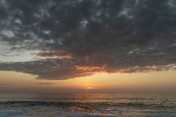 Sunset time in the Atlantic ocean, Nazare, Portugal.