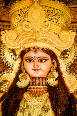 Chandannagar, West Bengal, India - November 16, 2018: Portrait of Hindu Goddess Jagadhatri Idol during Jagadhatri Puja celebration. Close up. Very well decorated goddess idol with heavy ornaments.