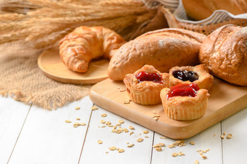 Danish bread with fruits, blueberry and cherry sauce