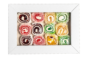 Turkish delight in the box isolated on a white background. Sweet candies in the box. Candy texture