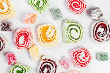 Sweet candy background. Colored candy on white background. Oriental sweets.