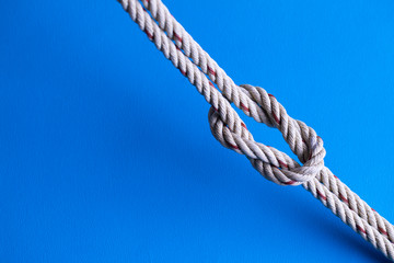 Reef Knot against blue background