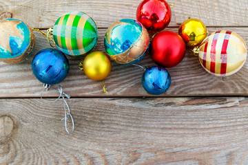 Christmas baubles on wooden background. Top view, copy space