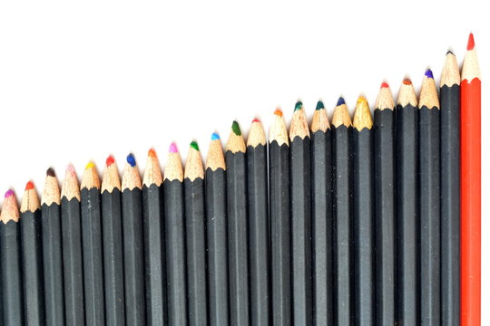 blunt used colored pencils black color with different lengths built on growth in the form of a even growing chart with a peak at red sharpened pencil on a white background