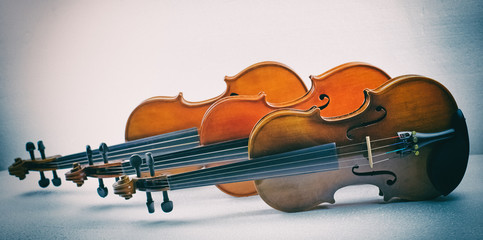 The abstract art design background of wooden violin stacked on background,show detail of violin