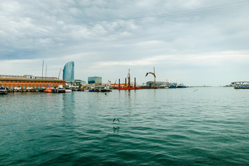 Yachts on the dock. Barcelona White ships in the city port. Spain.