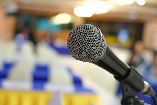 Microphone at seminar over blur background