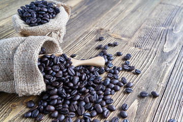 Fototapeta na wymiar Close up stack of coffee bean overflow from brown sack
