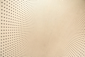 Yellow ceiling or wall full of black stars in a pattern wallpaper