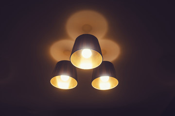 Three hanging lights in the bar