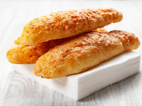 cheese buns, bread with cheese on a white wooden background
