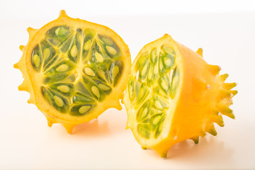 Kiwano or Horned Melon (Cucumis metuliferus) sliced in a half on white background isolated