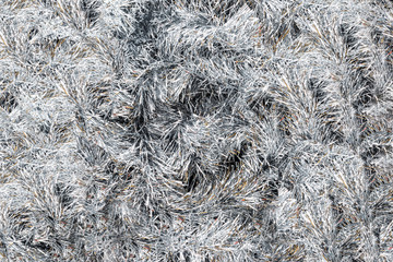 Pattern made from silver tinsel, christmas decorations.