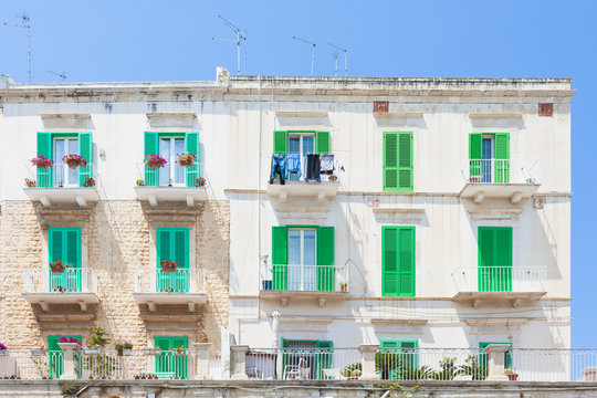 Molfetta, Apulia - Green window shutters at the historical facades in Molfetta