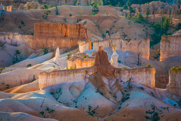 beautiful landscape in Bryce Canyon with magnificent Stone formation like Amphitheater, temples, figures in Morning light