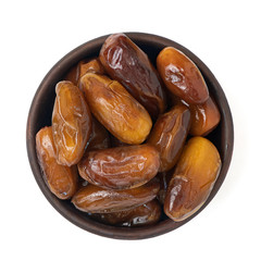 Dried date fruit in bowl isolated on white background. Top view
