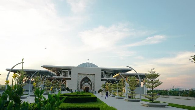 Beautiful sunset time lapse view of Tuanku Mizan Zainal Abidin Mosque or Iron Mosque by the Putrajaya lake in Putrajaya, Malaysia.Sky view