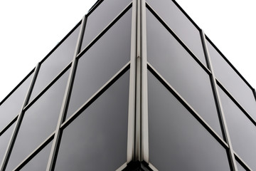 Fragment of glass and metal modern building. Business office exterior.