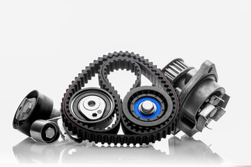 kit of timing belt with rollers on a white background